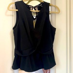 A sleeveless Black Top